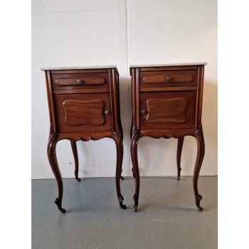 An exquisite and antique pair of bedside tables