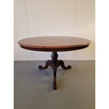 Round mahogany dining table
