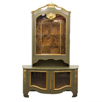 Display cabinet in green with gold accents and root-wood interior